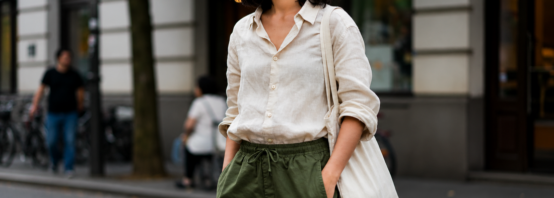 A women wewaring off white linen shirt by organo linen