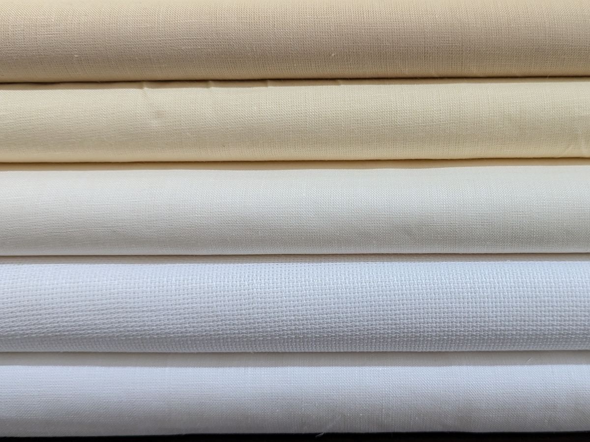 Folded linen fabric in white and cream shades