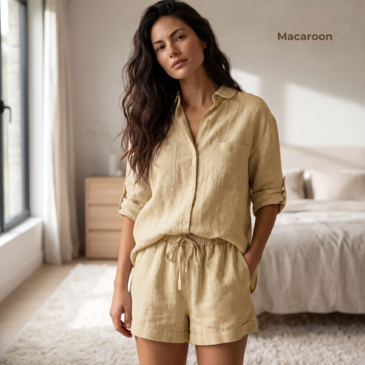 Woman wearing a beige linen outfit in a bedroom setting with 'Macaroon' branding.