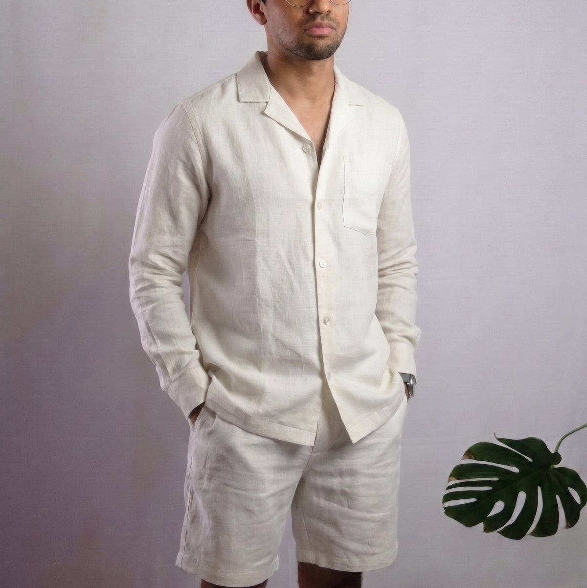 Man in a white linen shirt and white linen pants
